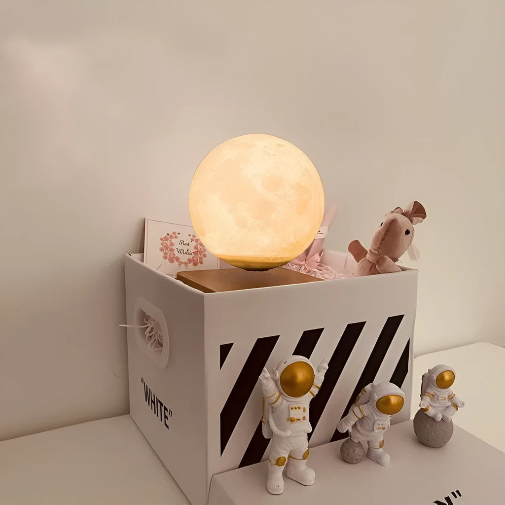 Maglev floating moon and earth night light with three astronaut figurines and soft LED glow.
