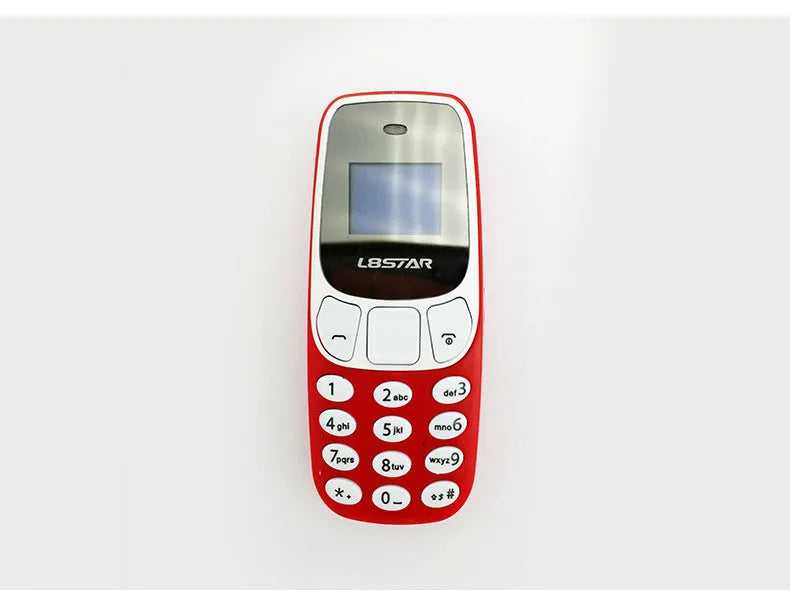Ultra-small miniature thumb phone with 0.66-inch OLED display and keypad, smaller than a lighter
