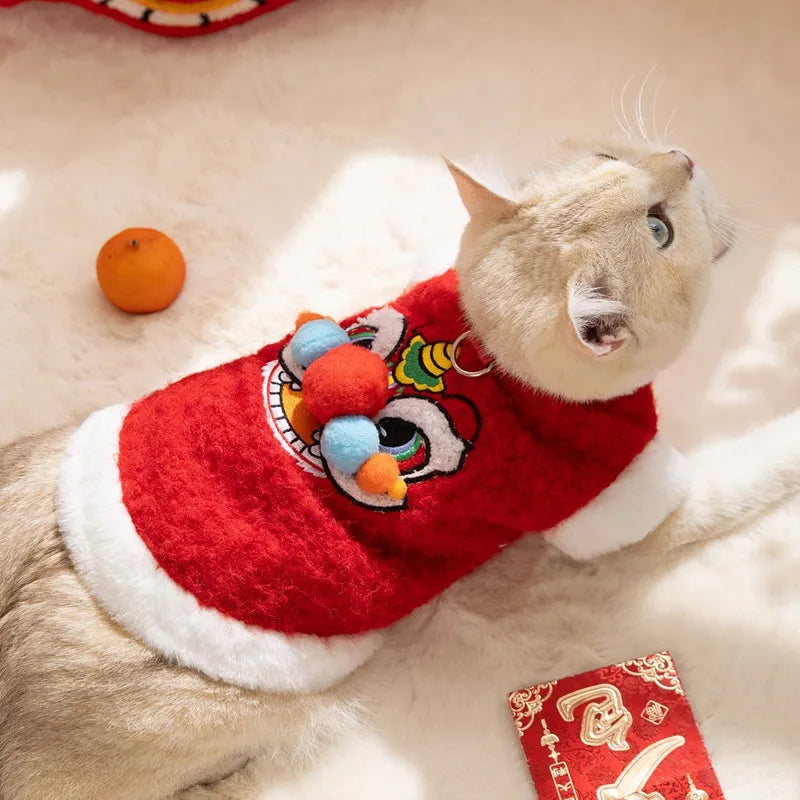 Red cotton-padded 3D lion dance pet vest with faux fur trim for small dogs and cats, featuring embellished eyes and pom-poms.