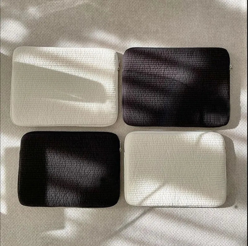 Black and white hand-held cotton cloth laptop clutch bag for tablet protection with coin pocket.