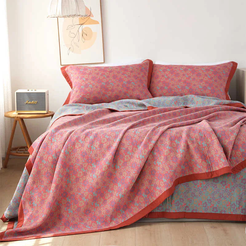 Cotton gauze three-piece blanket set with floral pattern and matching pillowcases for bed