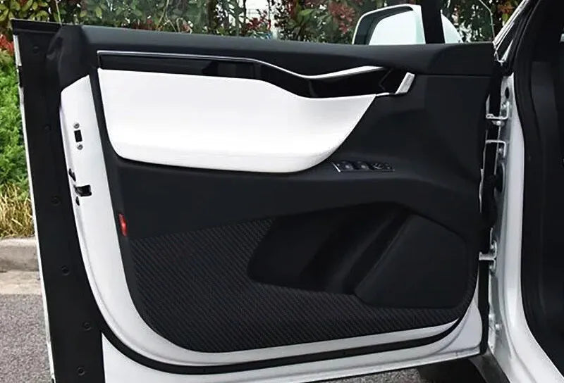 Carbon fibre protective film for Tesla Model S car door interior panels, four-piece pack.