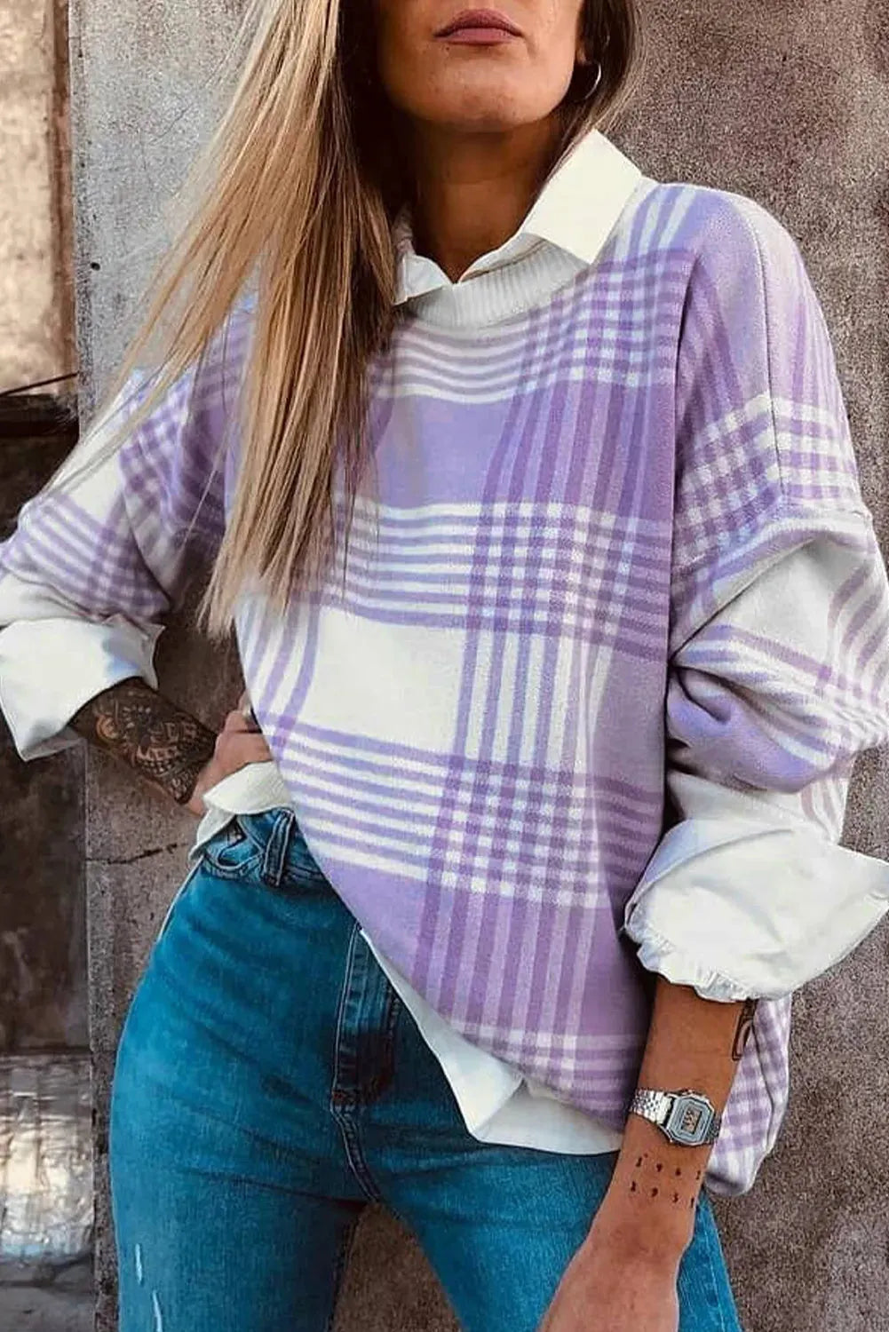 Loose fit long sleeve sweater in lilac plaid print with ribbed cuffs and hem.
