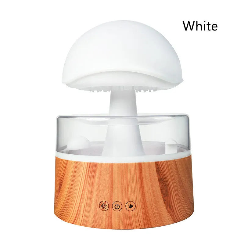 White rain cloud-shaped humidifier and essential oil diffuser on a surface