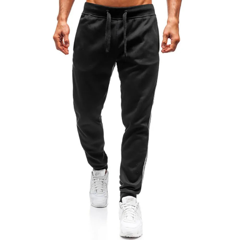 Men's summer casual loose tapered sports trousers in black with elastic waist, drawstring, and stitching details