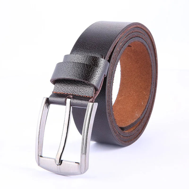 Leather pin buckle belt in black and camel colours on a plain background