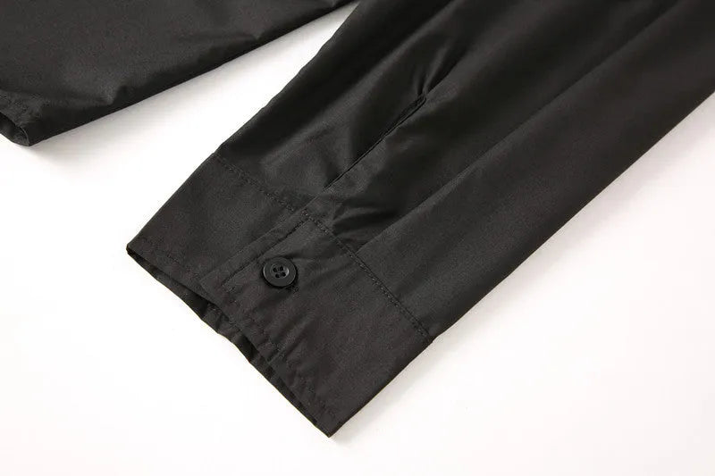 Teenage men's black stand-up collar shirt with fitted silhouette, shown front view, plain background.