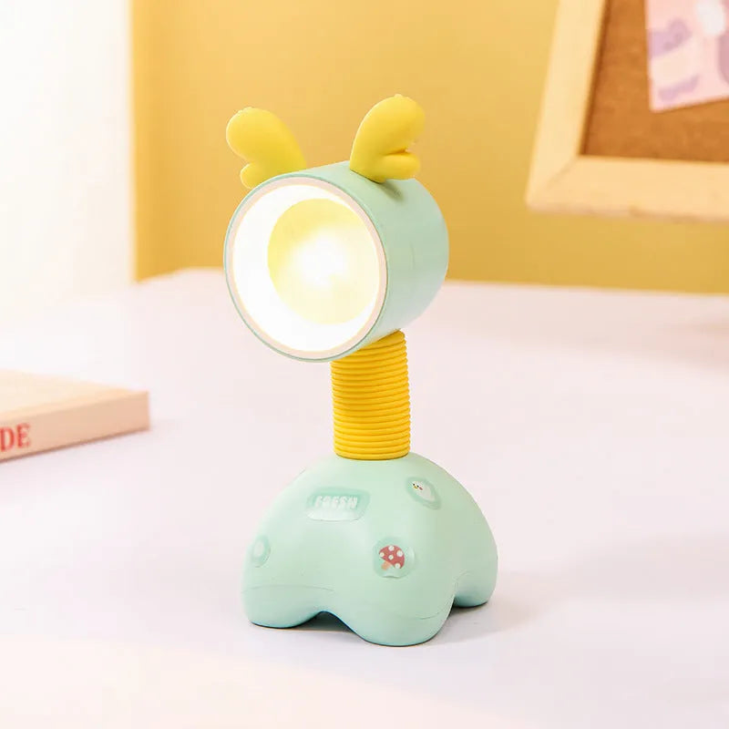 DIY cartoon magnetic small night lamp in assorted animal styles and colours on a desktop.