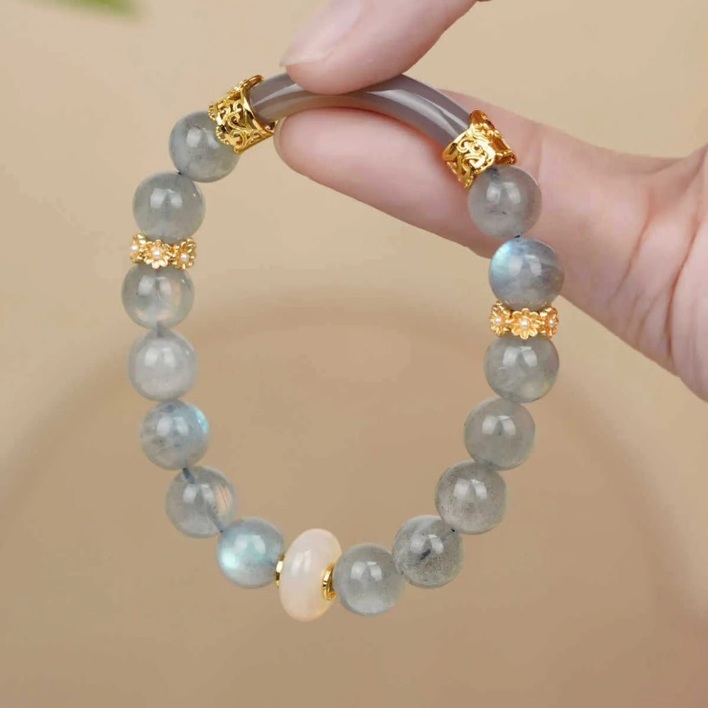 Emerald green jade bangle bracelet with floating flower design and round beads