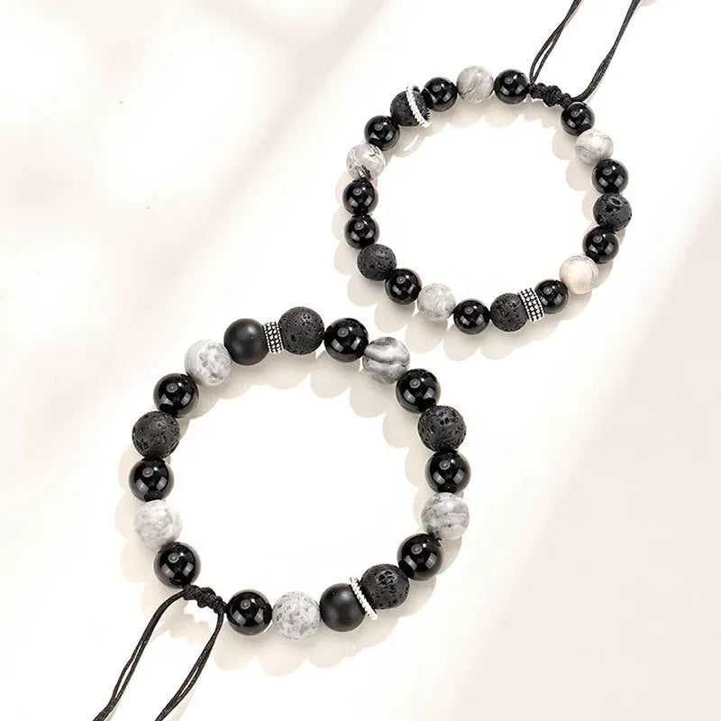 Black agate volcanic rock bracelet with diamond-cut facets, shown in two width sizes.