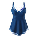 Plus size green two-piece bikini swimsuit with backless briefs style on a mannequin.