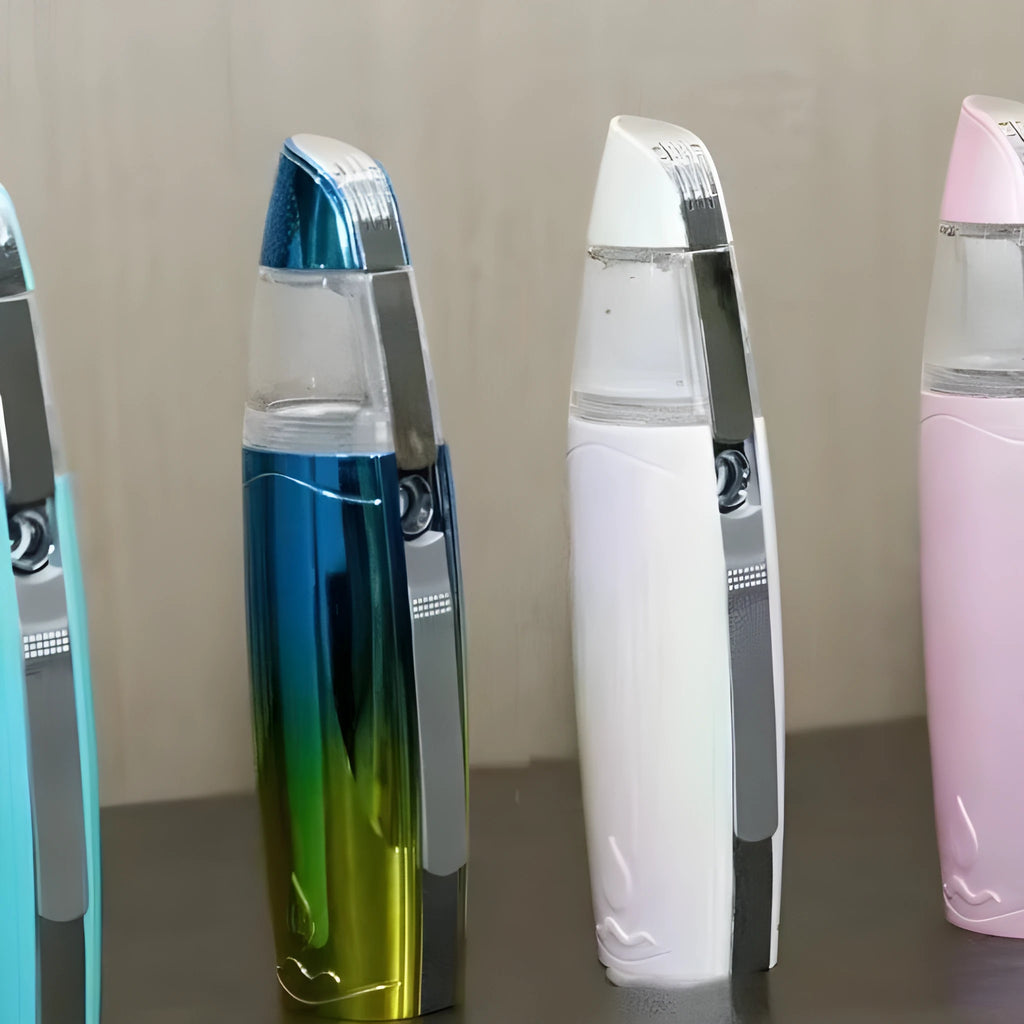 Peacock blue handheld facial steaming device with USB charging port for hydrogen-rich water spray moisturising