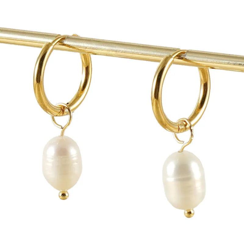 Gold geometric women's earrings with freshwater pearls on stainless steel and titanium posts.