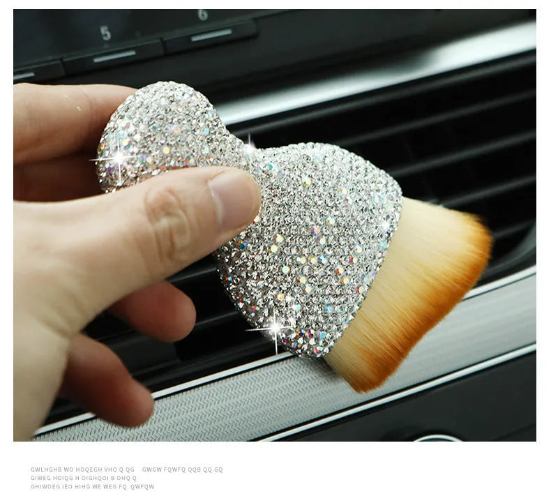 White PVC car interior cleaning brush on a car dashboard, showing its compact size and soft bristles.