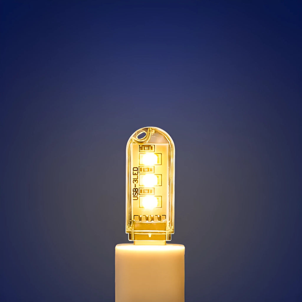 Compact USB-powered LED baby night light showing warm and white light colour options.