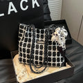 Black wool blend horizontal square shoulder bag with internal compartments for commuting and shopping