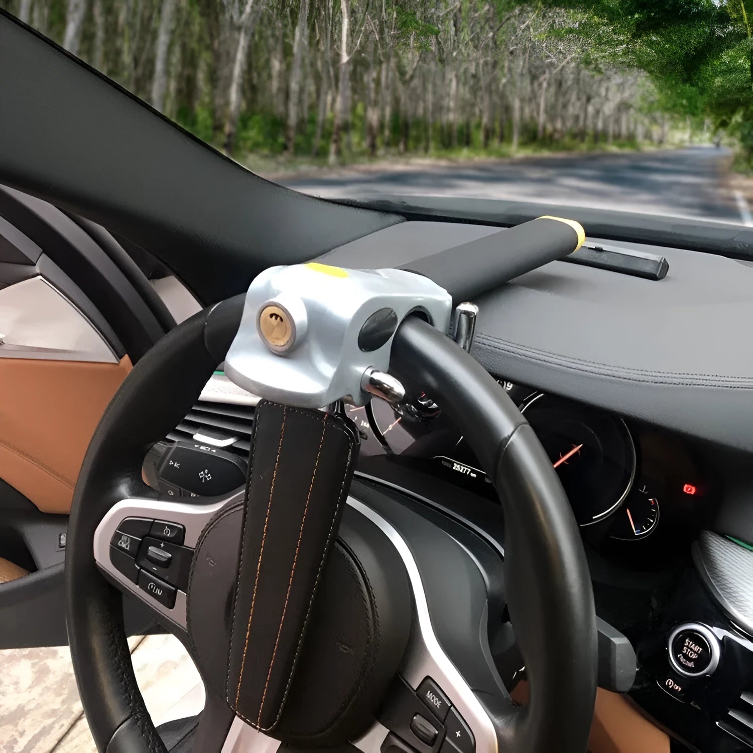 Universal car steering wheel lock with alarm in black gold finish on vehicle steering wheel