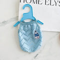 Dog wearing blue mesh cooling vest with adjustable camisole-style straps