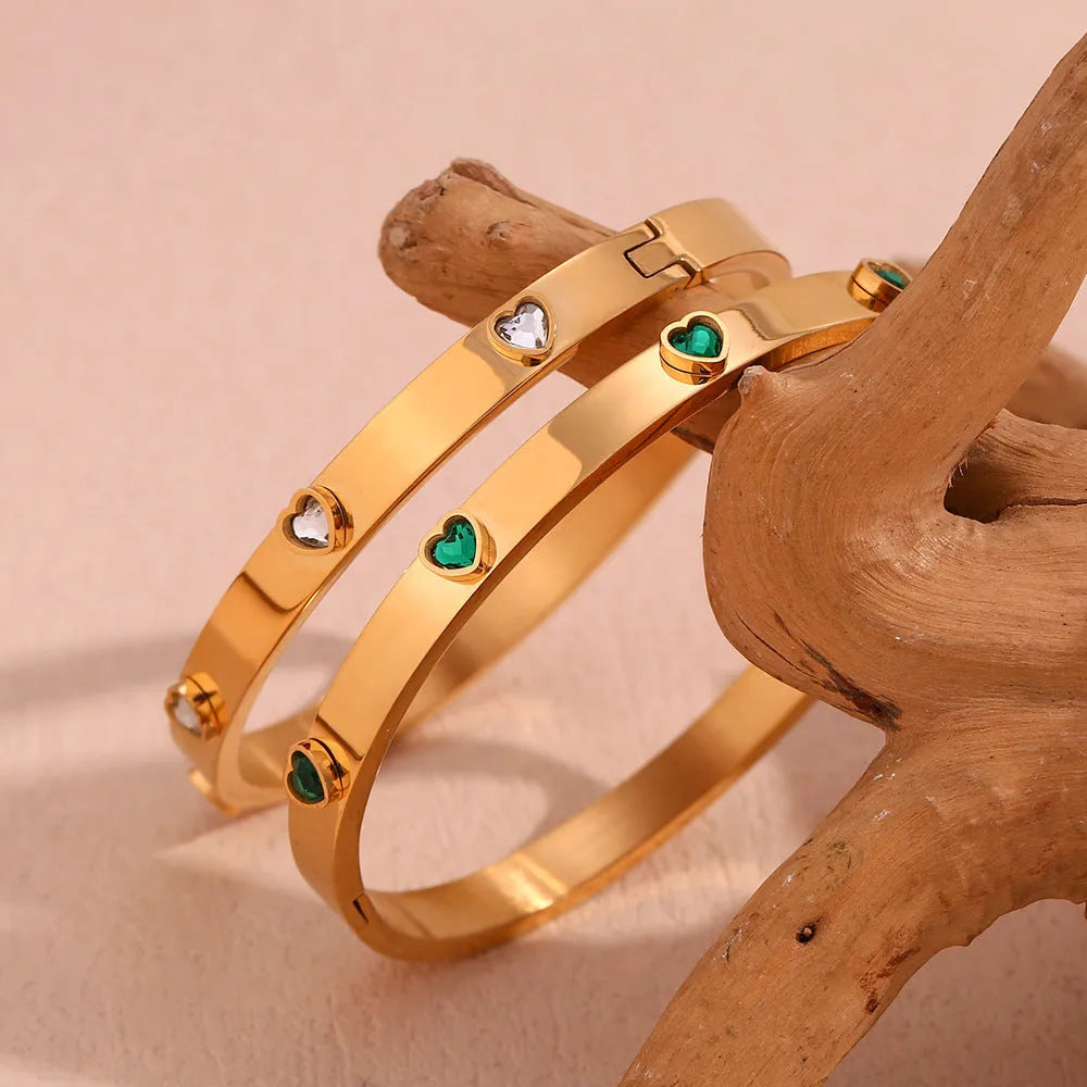 Stainless steel bracelet with a peach heart charm, shown in golden-lvzuan finish.