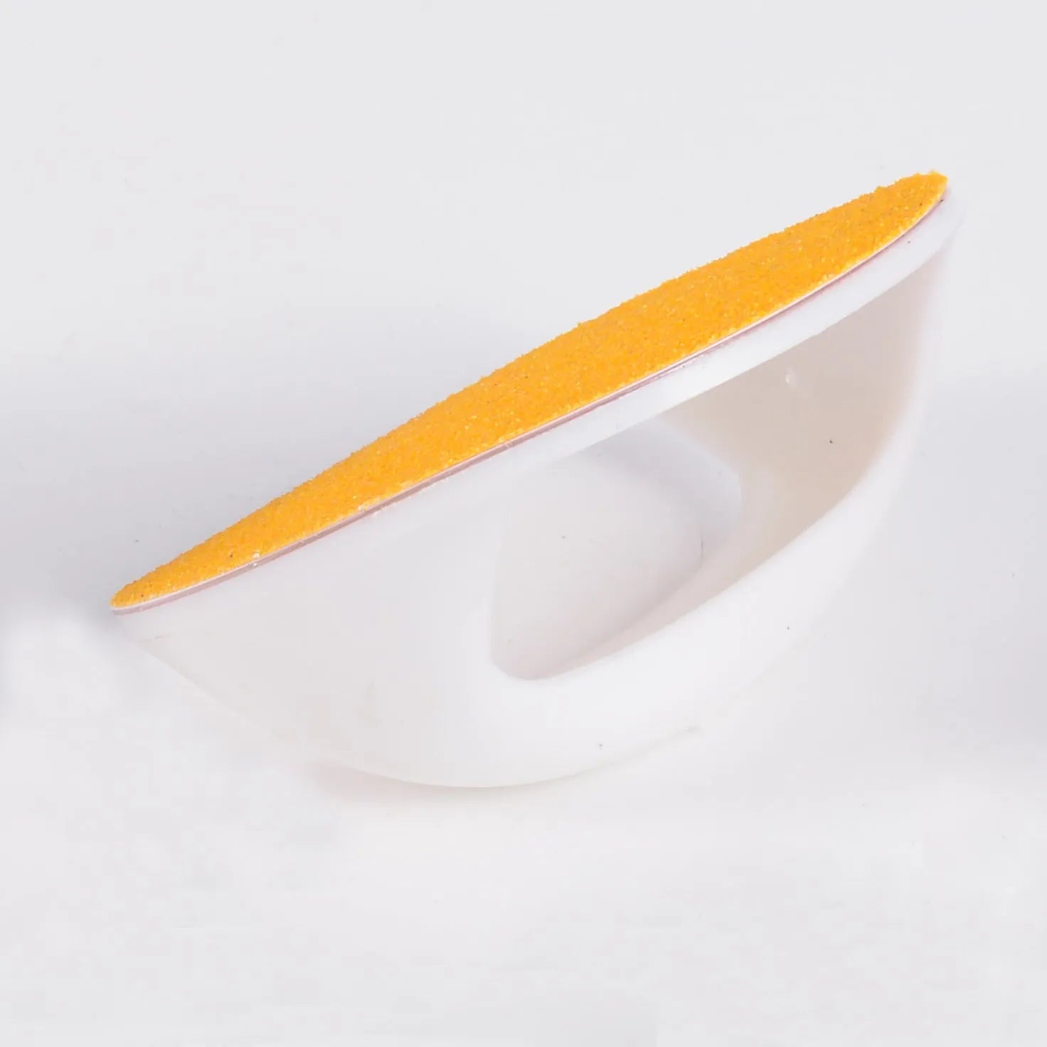 Dog nail file board with coloured handle and sandpaper surface for pet grooming