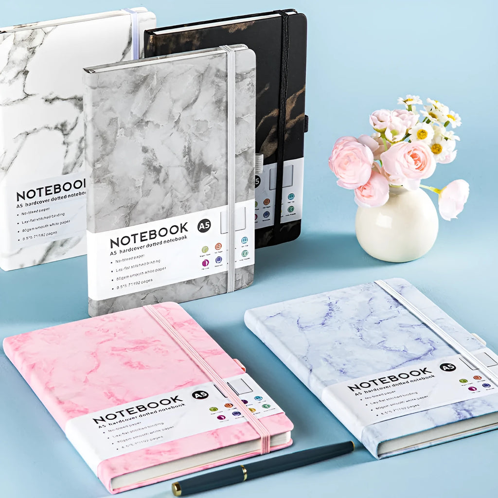A5 PU leather strap notebook with horizontal lines available in marble and skin-feeling colours like black, blue, and gold