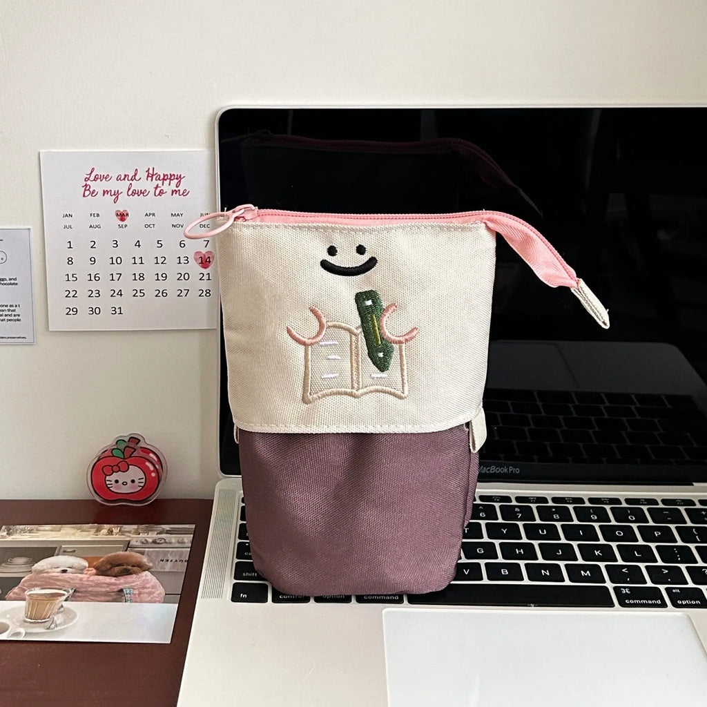 Brown collapsible pencil case with cartoon design measuring 17x14cm