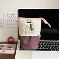 Brown collapsible pencil case with cartoon design measuring 17x14cm