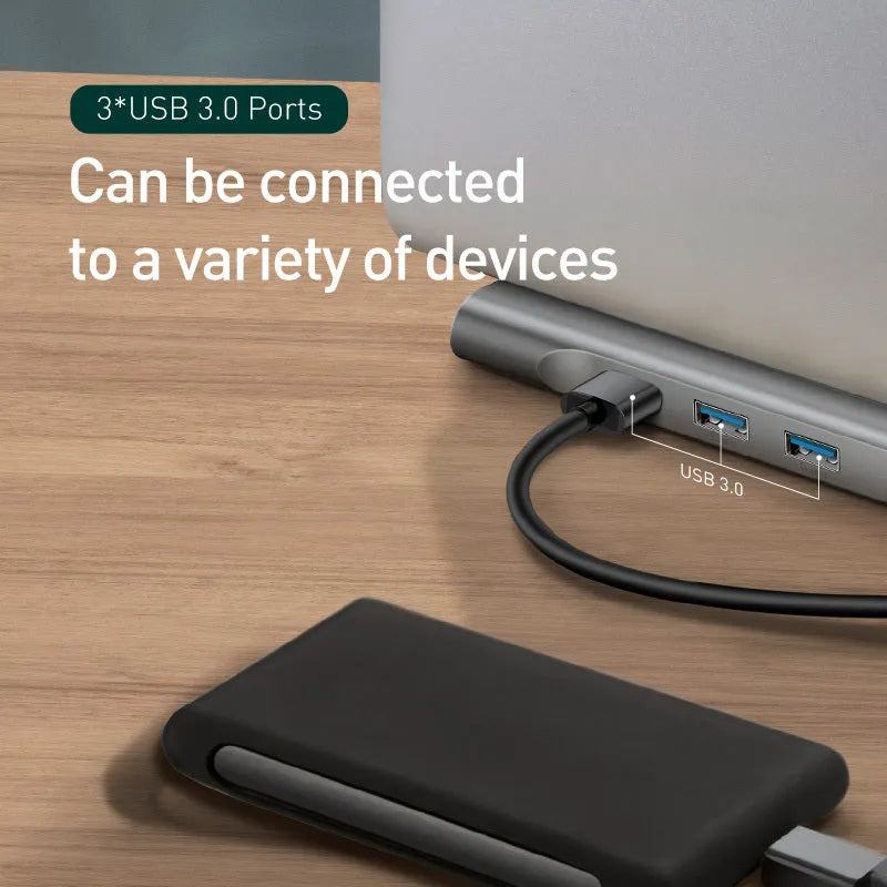 Black and grey aluminium USB-C hub docking station with ten ports and an integrated laptop cooling bracket.