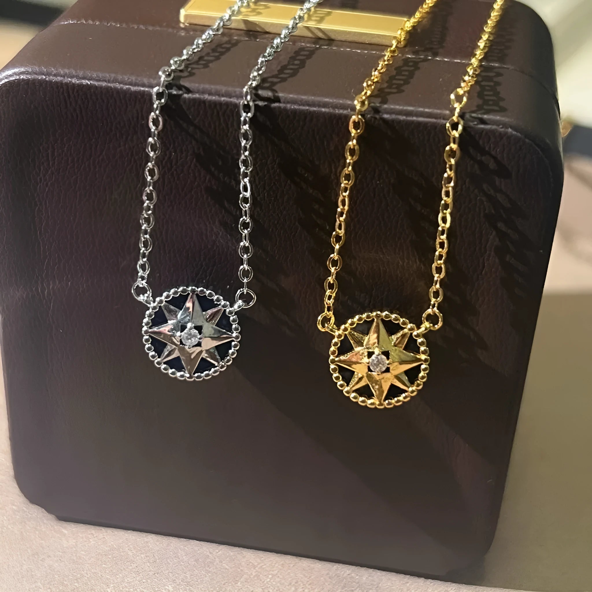 Gold-plated compass necklace for women with round black agate pendant on adjustable curb chain