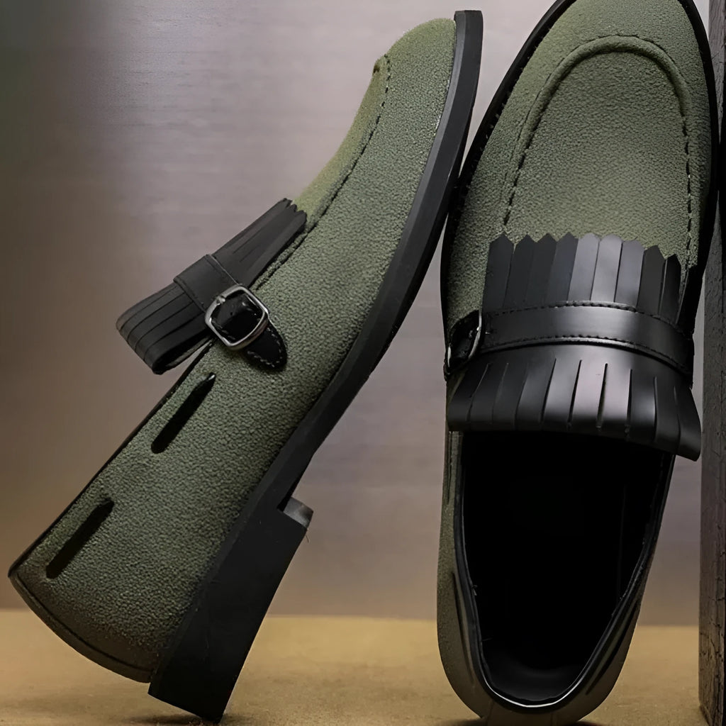 Men's gray denim loafer shoes with tassel accents, pointed toe, flat heel, on a white background