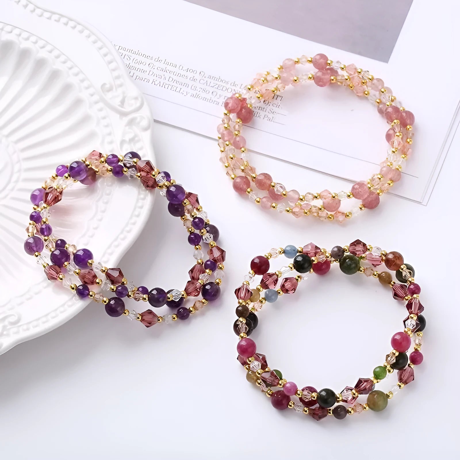 Handmade three-ring bracelet with colourful tourmaline, strawberry quartz, and amethyst beads on an adjustable cord.