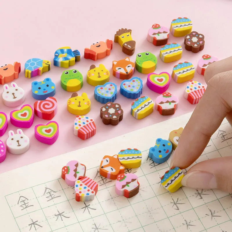 Assortment of 50 colourful cartoon-themed mini erasers including fruit, animal, and holiday designs.