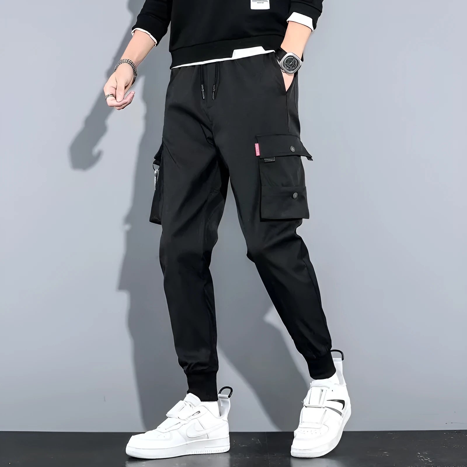Men's cotton-polyester sports overalls in black with embossed finish and printed details, side view