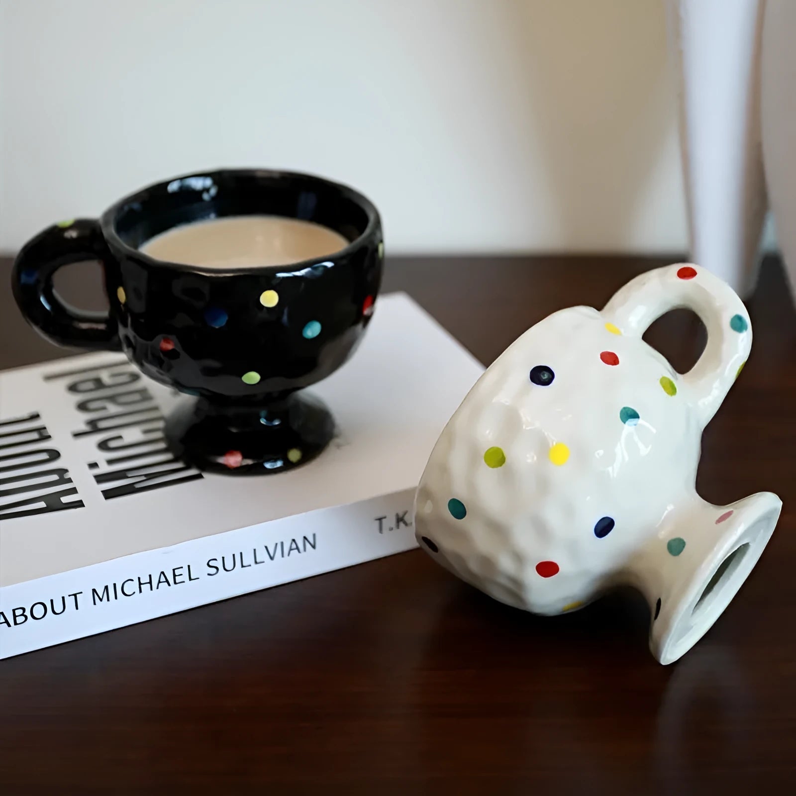 Hand-pinched irregular ceramic mug in a solid colour, shown from the side.
