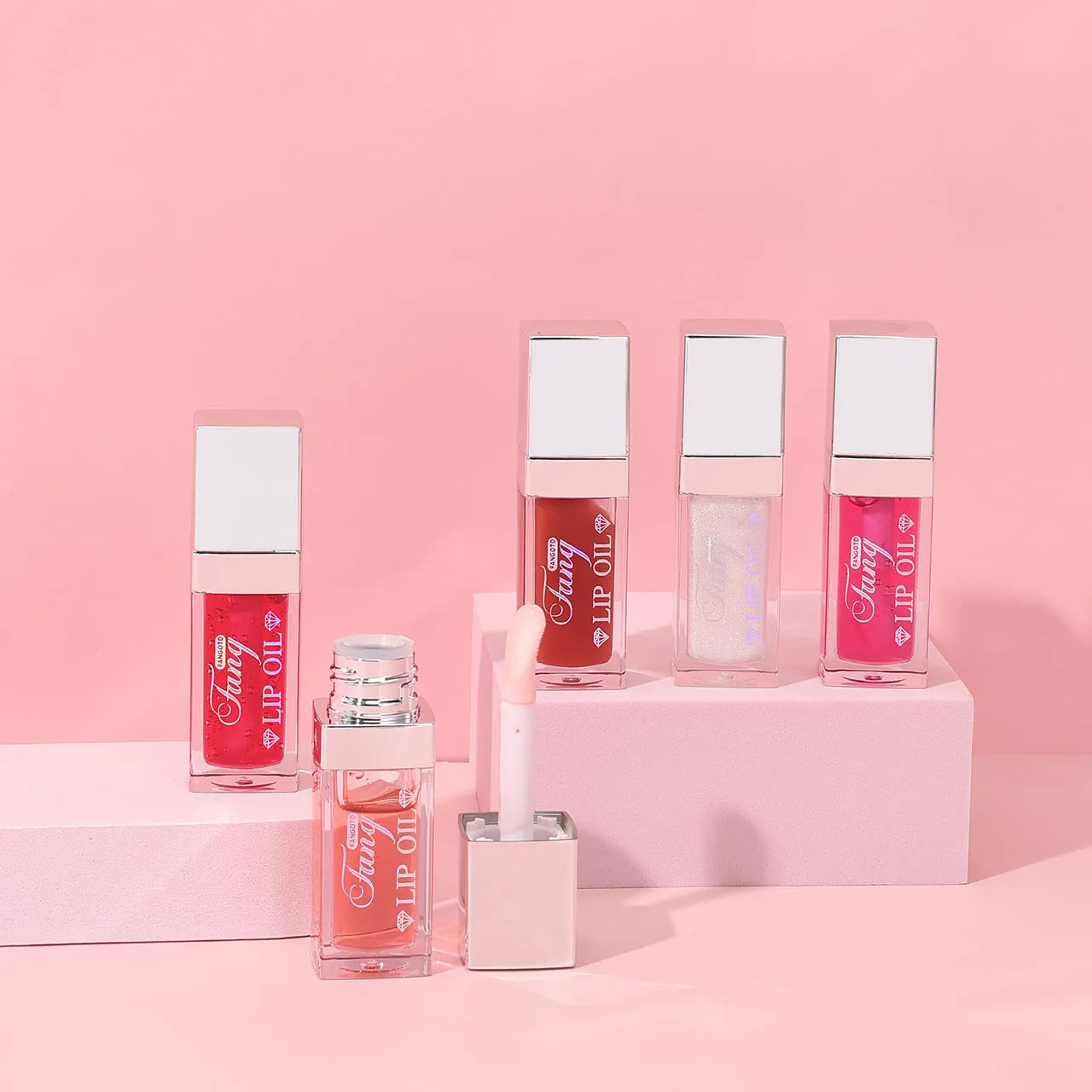 Set of five bright mint lip gloss tubes and one lip essence oil bottle for moisturising and repair.