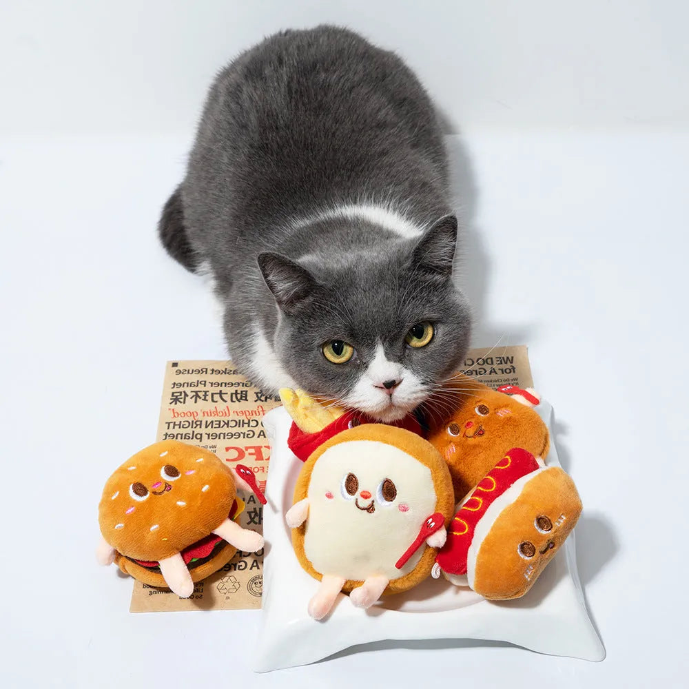 Set of five soft cat chew toys shaped like a hamburger, chicken leg, fries, bread, and hot dog for teething kittens.
