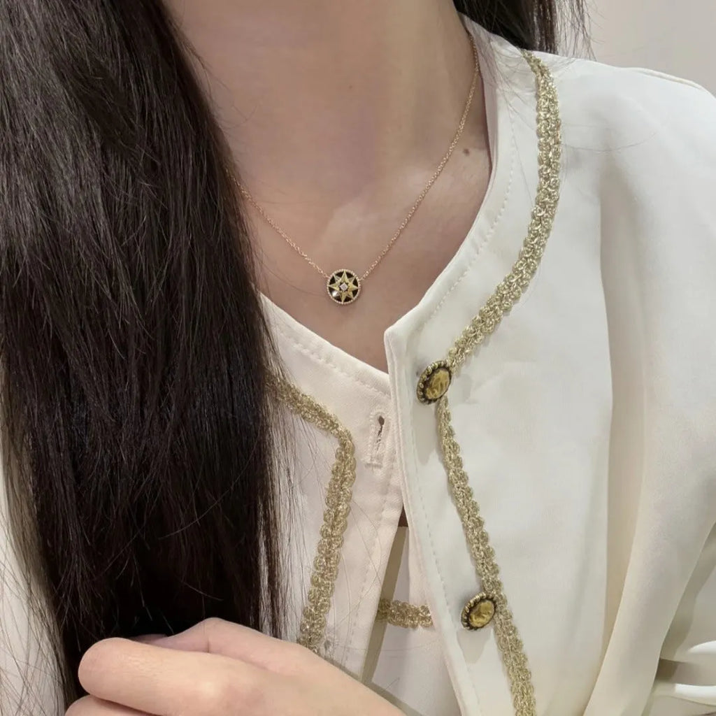 Gold-plated compass necklace for women with round black agate pendant on adjustable curb chain