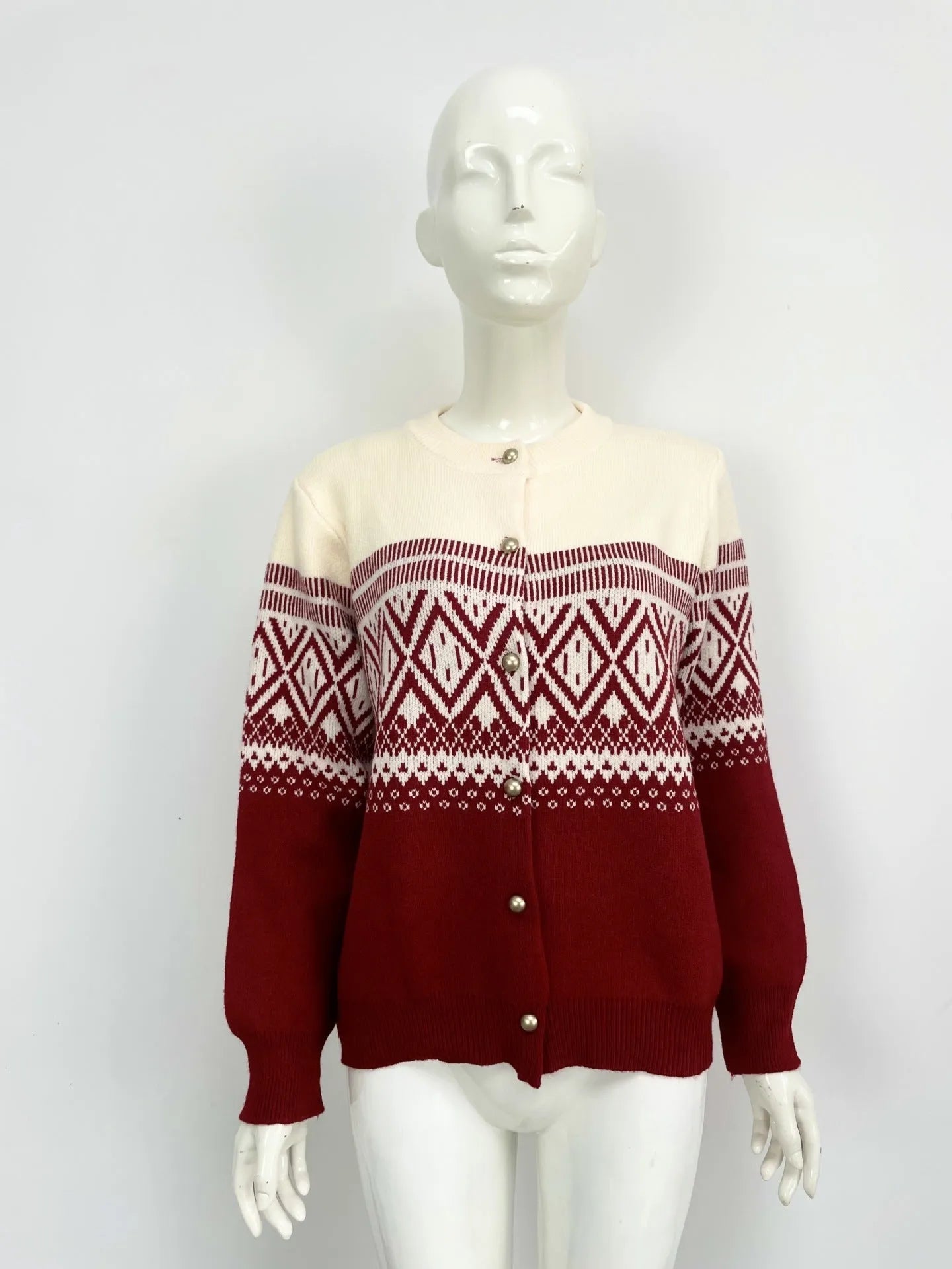 Women's alpaca wool cardigan with contrast colour diamond pattern showing long sleeves and street fashion styling