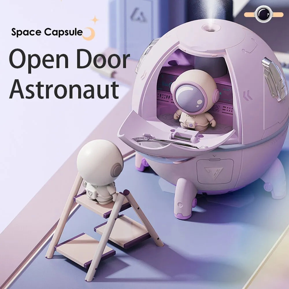 Purple astronaut-shaped USB desktop humidifier with colourful LED lights showing 220ml water capacity