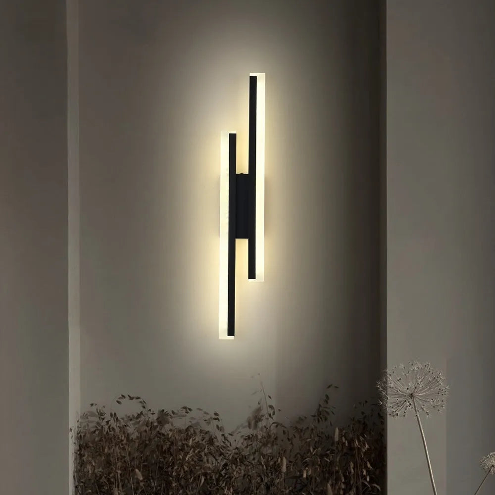 Gold double line wall lamp with linear LED lighting mounted on corridor wall