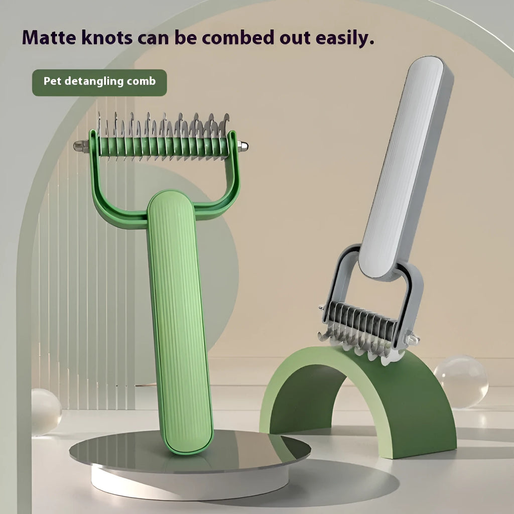 Green pet detangling comb with stainless steel teeth and plastic handle