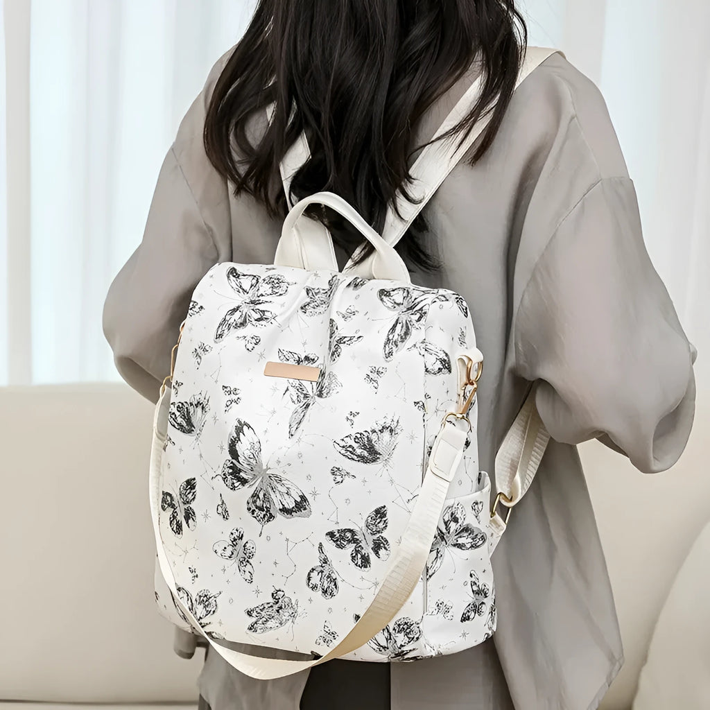 Butterfly print PU backpack on a physiological curve backplate, shown in khaki colour.