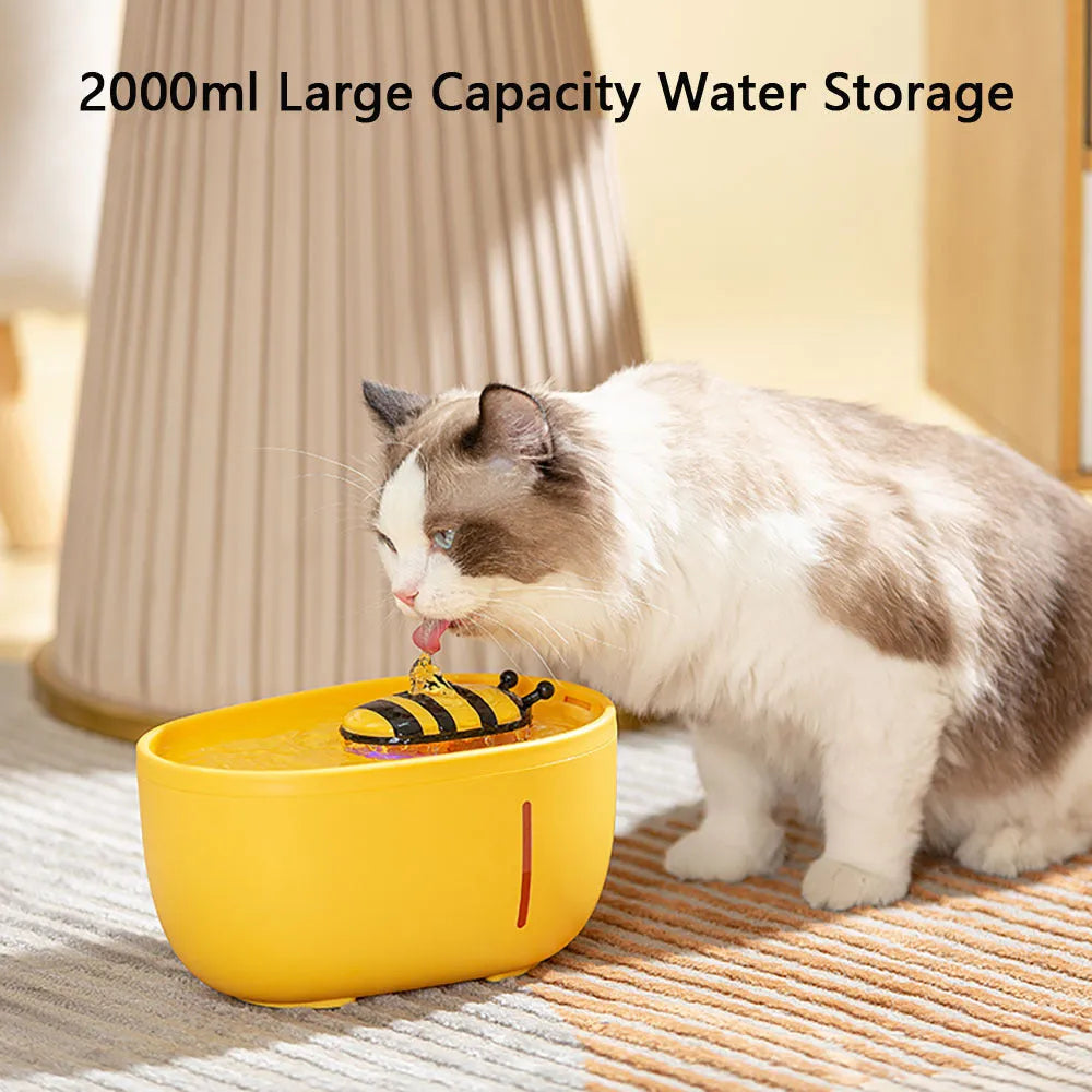 Yellow automatic cat water fountain with filtration system, water level window, and USB cable