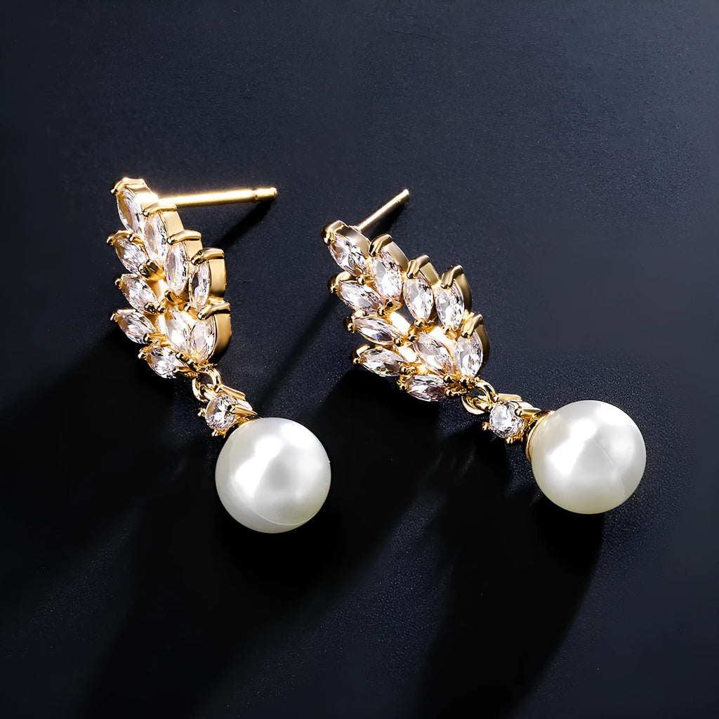 Geometric floral design earrings with micro inlaid zircon detail in gold, platinum, or rose gold plating.