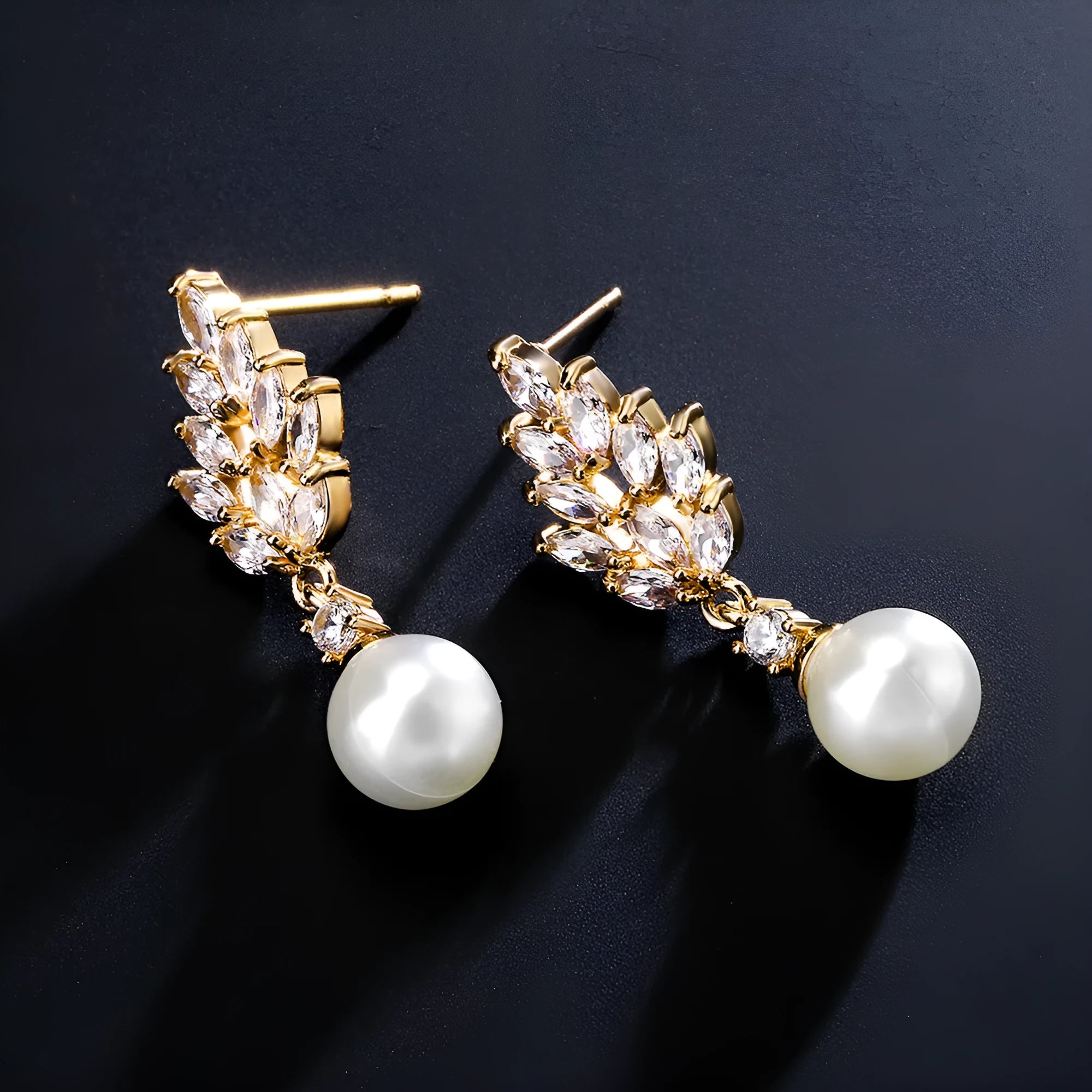 Geometric floral design earrings with micro inlaid zircon detail in gold, platinum, or rose gold plating.