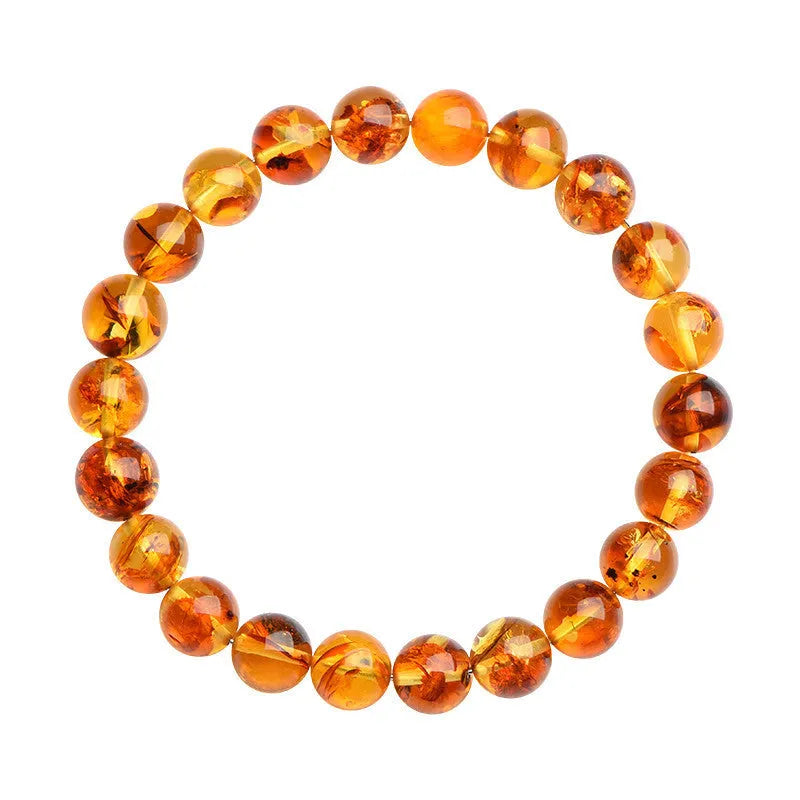 A geometric bead bracelet made from natural yellow piebald amber with flower spot patterning.