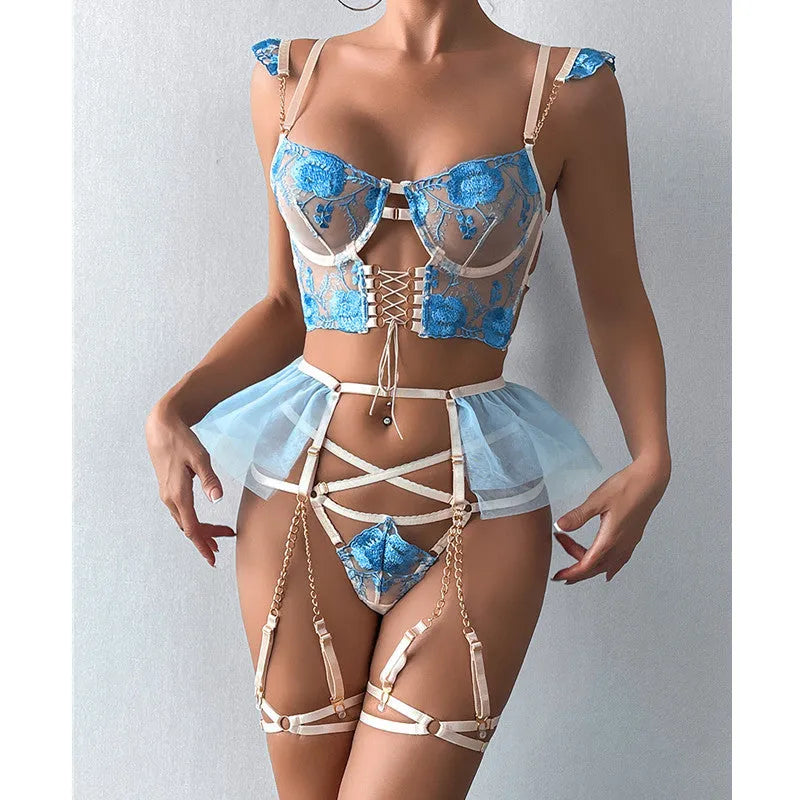Light blue embroidered lace push-up bra and mesh pants lingerie set on a neutral background.