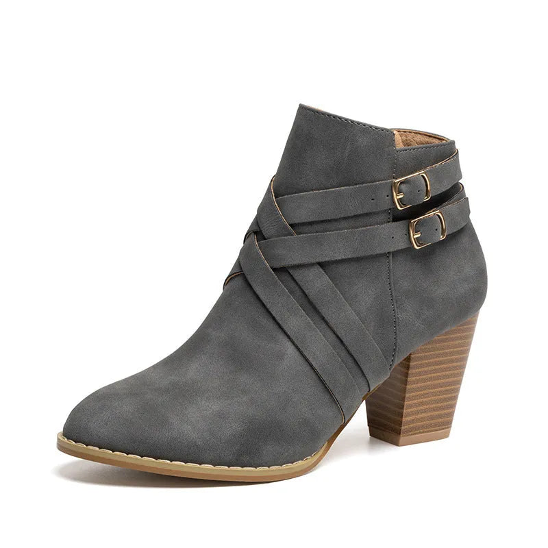 Women's black PU leather ankle boot with side zipper and 7cm heel on a rubber sole