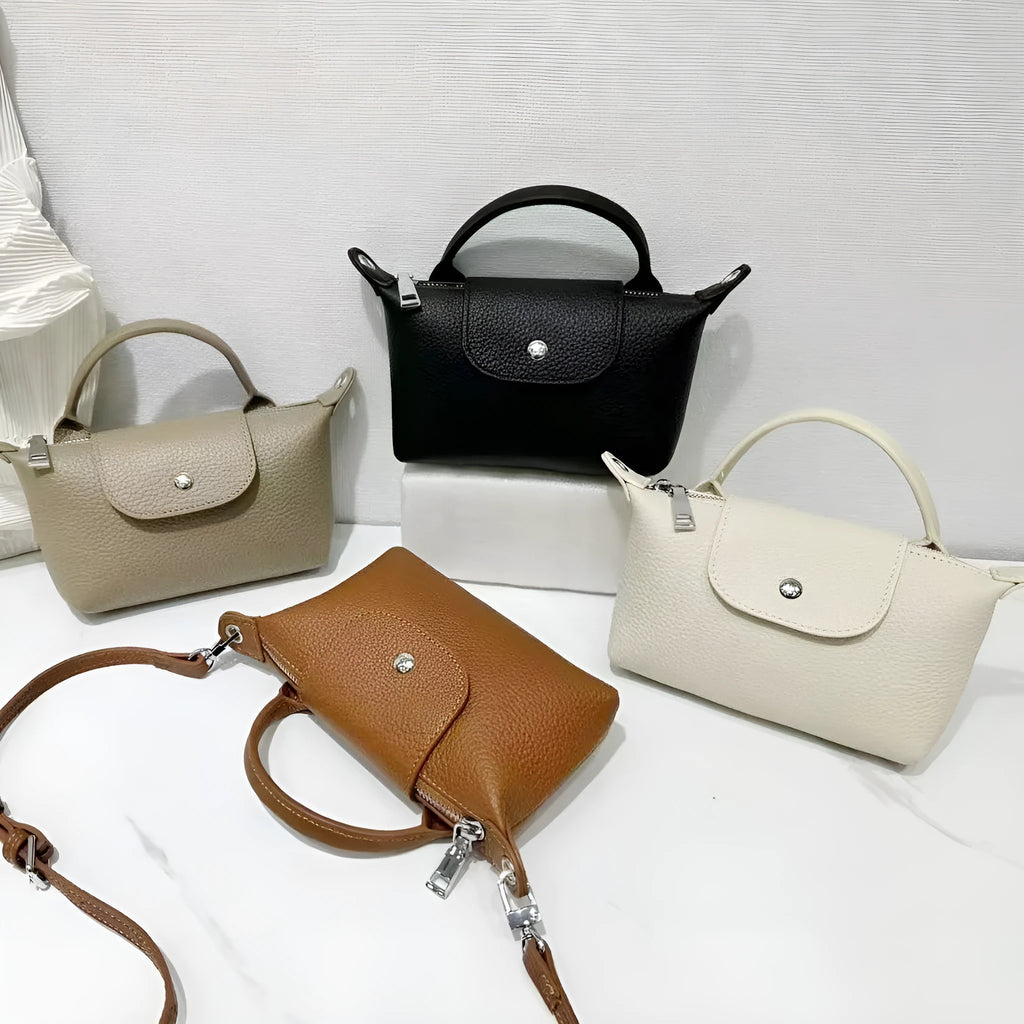 Top grain leather crossbody phone bag in dumpling shape with splicing detail available in black