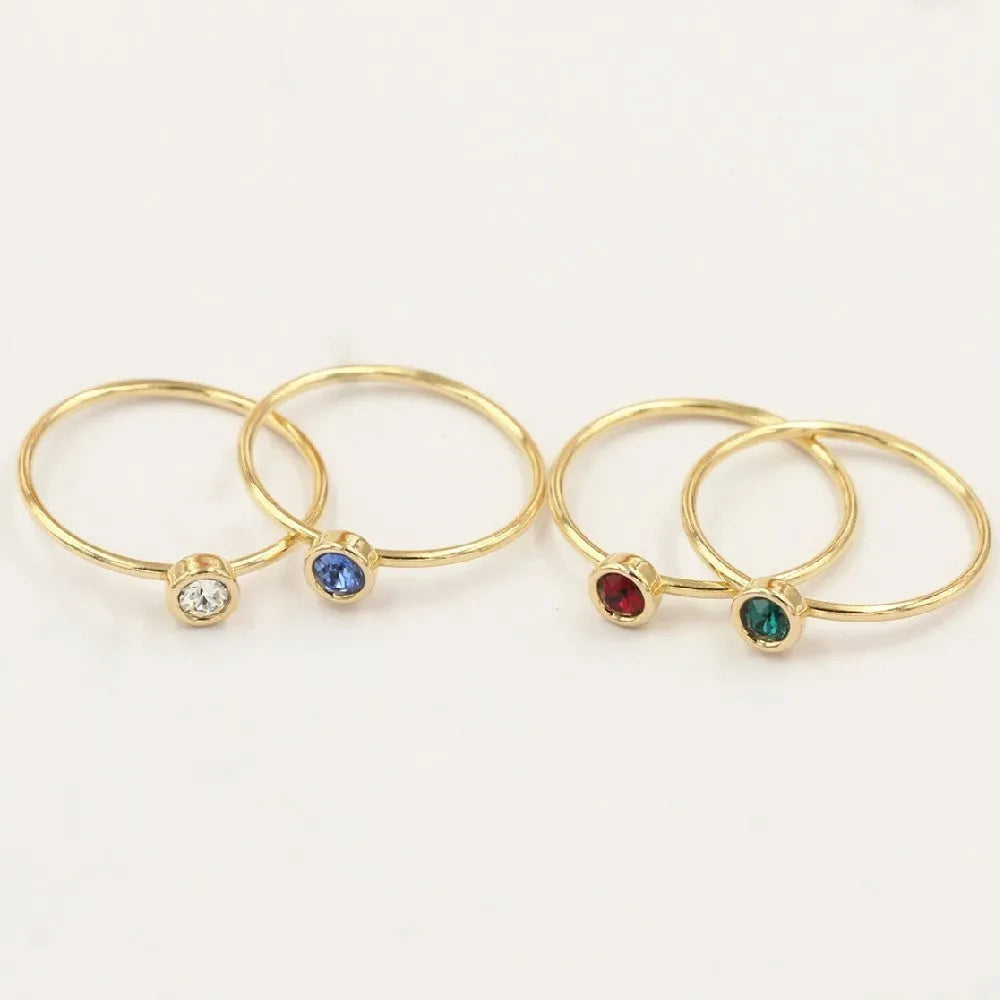 14K gold gilded brass knuckle ring with zircon stones in green blue dark red white colours